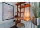 Stylish desk area featuring wooden shelving and a cozy stool, perfect for a workspace at 541 W Palm Ln, Phoenix, AZ 85003