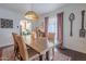 Cozy dining room with a large wooden table, stylish chairs, and soft, natural light at 541 W Palm Ln, Phoenix, AZ 85003