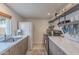 The kitchen has marble counters, modern appliances, and lots of natural light with wooden accents at 541 W Palm Ln, Phoenix, AZ 85003