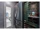 Modern refrigerator with view of the kitchen and an adjacent wine refrigerator and diamond-patterned backsplash at 541 W Palm Ln, Phoenix, AZ 85003