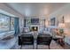 Spacious living room featuring a fireplace, large bay window, and stylish furniture arrangement at 541 W Palm Ln, Phoenix, AZ 85003