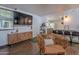 Open-concept living area with stylish furnishings, wood-look flooring, and seamless flow to the kitchen, ideal for modern living at 541 W Palm Ln, Phoenix, AZ 85003