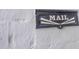 Close up of black vintage mailbox with the word MAIL emblazoned on a white brick wall at 541 W Palm Ln, Phoenix, AZ 85003