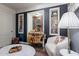 Charming sitting area features dark accent walls, built-in shelving, and marble coffee table at 541 W Palm Ln, Phoenix, AZ 85003