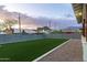 Green turf backyard with block wall and mountain views at 6244 S Flora Ln, Gold Canyon, AZ 85118