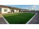 Expansive backyard featuring a well-maintained lawn and covered patio, perfect for outdoor living at 6244 S Flora Ln, Gold Canyon, AZ 85118