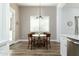 Well-lit dining area showcases wood floors and a view to the exterior yard at 6244 S Flora Ln, Gold Canyon, AZ 85118