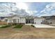 Charming single-story home with a well-manicured front yard, a two car garage and welcoming curb appeal at 6244 S Flora Ln, Gold Canyon, AZ 85118