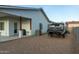 Exterior side view of home showcasing the xeriscaped side yard at 6244 S Flora Ln, Gold Canyon, AZ 85118