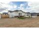 Stylish single-Gathering house featuring a side yard, a two car garage, and modern exterior details at 6244 S Flora Ln, Gold Canyon, AZ 85118