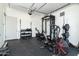 Spacious home gym with exercise equipment and overhead door at 6244 S Flora Ln, Gold Canyon, AZ 85118