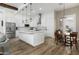 Bright, open kitchen featuring a large island, stainless appliances, and stylish pendant lighting at 6244 S Flora Ln, Gold Canyon, AZ 85118