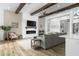 Cozy living room with a modern fireplace, shiplap accent wall, and a comfortable seating area at 6244 S Flora Ln, Gold Canyon, AZ 85118