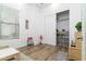 Bright playroom with wood floors, organized storage, and closet at 6244 S Flora Ln, Gold Canyon, AZ 85118