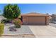 Charming single-story home featuring a low-maintenance desert landscape and a two-car garage at 6413 W Monte Cristo Ave, Glendale, AZ 85306