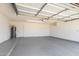 Spacious two car garage featuring epoxy flooring, a water heater and garage door opener at 6413 W Monte Cristo Ave, Glendale, AZ 85306