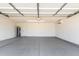 Spacious two car garage featuring epoxy flooring, a water heater and garage door opener at 6413 W Monte Cristo Ave, Glendale, AZ 85306
