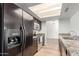 Eat-in kitchen with stainless steel appliances, wood cabinets and recessed lighting at 6413 W Monte Cristo Ave, Glendale, AZ 85306