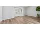 Bright living room with hardwood floors and a large window providing natural light at 6413 W Monte Cristo Ave, Glendale, AZ 85306
