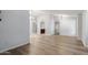 Open living space featuring modern flooring and a wet bar in the background at 6413 W Monte Cristo Ave, Glendale, AZ 85306