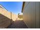 View of the side yard with gravel and small patch of grass at 6413 W Monte Cristo Ave, Glendale, AZ 85306