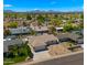 Aerial view of a residential area with single-Gathering homes and a mountain backdrop at 6833 E Grandview Dr, Scottsdale, AZ 85254