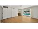 Bedroom with wood-look floors, backyard pool view, and bathroom with vanity at 6833 E Grandview Dr, Scottsdale, AZ 85254