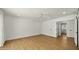 Bedroom with wood-look floors, ceiling fan, and access to the hallway at 6833 E Grandview Dr, Scottsdale, AZ 85254