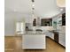 Modern kitchen featuring stainless steel appliances, granite countertops, and a stylish island with pendant lighting at 6833 E Grandview Dr, Scottsdale, AZ 85254