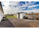 A backyard featuring gravel, and a storage shed ideal for outdoor gatherings at 6908 W Wanda Lynn Ln, Peoria, AZ 85382