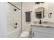 Bathroom featuring a tiled shower over tub, toilet, and a granite vanity at 6908 W Wanda Lynn Ln, Peoria, AZ 85382