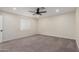 Neutral bedroom with carpeting and a ceiling fan at 6908 W Wanda Lynn Ln, Peoria, AZ 85382