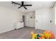 Bedroom featuring a carpeted floor, a dresser, double door closet, and a door to the hallway at 6908 W Wanda Lynn Ln, Peoria, AZ 85382