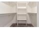 Walk-in closet with shelves and clothing racks at 6908 W Wanda Lynn Ln, Peoria, AZ 85382