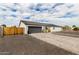Modern home featuring a gray garage door, light stucco exterior, and well-maintained landscaping at 6908 W Wanda Lynn Ln, Peoria, AZ 85382
