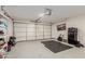 Spacious garage featuring sealed concrete floor, ample storage, and an automatic garage door at 6908 W Wanda Lynn Ln, Peoria, AZ 85382