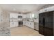 Bright kitchen with white cabinets, stainless steel appliances, and granite countertops at 6908 W Wanda Lynn Ln, Peoria, AZ 85382