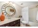 Inviting bathroom with stylish mirror, vanity, and combination tub and shower at 7800 E Lincoln Dr # 1035, Scottsdale, AZ 85250