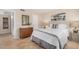 Comfortable bedroom featuring a queen-sized bed with a decorative mirror and dresser at 7800 E Lincoln Dr # 1035, Scottsdale, AZ 85250