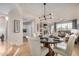 Bright dining area with modern lighting, neutral tones, and an open layout to the living area at 7800 E Lincoln Dr # 1035, Scottsdale, AZ 85250