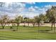 Golf course with mountain views and golfers enjoying a round of golf at 7800 E Lincoln Dr # 1035, Scottsdale, AZ 85250