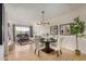 Bright and airy living room flowing into dining area, enhanced by natural light at 7800 E Lincoln Dr # 1035, Scottsdale, AZ 85250