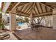 Shaded community gazebo with seating, overlooking a sparkling blue pool at 7800 E Lincoln Dr # 1035, Scottsdale, AZ 85250