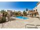 Community pool area with lounge chairs, palm trees, and well-maintained landscaping at 7800 E Lincoln Dr # 1035, Scottsdale, AZ 85250