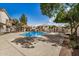 Inviting community pool surrounded by lush landscaping and comfortable lounge seating at 7800 E Lincoln Dr # 1035, Scottsdale, AZ 85250