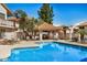 Sparkling community pool with comfortable lounge seating and a shaded gazebo at 7800 E Lincoln Dr # 1035, Scottsdale, AZ 85250