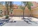 Condo with a two-car garage, a stucco exterior, with a terracotta roof at 8245 E Bell Rd # 128, Scottsdale, AZ 85260