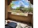 Charming patio with scenic views of lush landscape and blue skies, perfect for outdoor relaxation and entertaining at 8245 E Bell Rd # 128, Scottsdale, AZ 85260