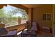 Relaxing covered patio with desert views, comfortable seating, and an open-air feel at 8245 E Bell Rd # 128, Scottsdale, AZ 85260