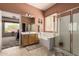 En-suite bathroom featuring a large soaking tub, glass enclosed shower and wood vanity at 8307 S Desert Preserve Ct, Gold Canyon, AZ 85118